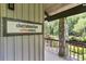 Exterior shot of the coffee shop entrance, featuring stone accents and a view of the outdoor area at 1021 Riverbend Club Se Dr, Atlanta, GA 30339