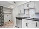 Bright kitchen area with stainless steel dishwasher, sink, and modern cabinetry at 1021 Riverbend Club Se Dr, Atlanta, GA 30339
