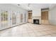 Sunroom featuring tile floor, fireplace, and large windows at 1021 Riverbend Club Se Dr, Atlanta, GA 30339