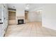 Bright open living room with fireplace, built-ins, and tile flooring at 1021 Riverbend Club Se Dr, Atlanta, GA 30339