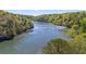 Scenic river view surrounded by lush greenery, offering a tranquil and picturesque setting at 1021 Riverbend Club Se Dr, Atlanta, GA 30339