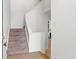Carpeted staircase leading to the upper level of the home at 1021 Riverbend Club Se Dr, Atlanta, GA 30339
