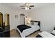 Comfortable bedroom featuring a ceiling fan, neutral walls and modern furniture at 2400 Cumberland Se Pkwy # 803, Atlanta, GA 30339