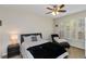 Bright bedroom featuring a ceiling fan, plantation shutters and a chaise lounge at 2400 Cumberland Se Pkwy # 803, Atlanta, GA 30339