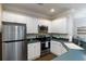Compact kitchen featuring stainless steel appliances and ample counter space at 2400 Cumberland Se Pkwy # 803, Atlanta, GA 30339