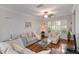 Cozy living room filled with natural light, plush seating, and hardwood flooring at 2400 Cumberland Se Pkwy # 803, Atlanta, GA 30339