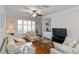 Bright and inviting living room showcasing neutral tones and comfortable furniture arrangement at 2400 Cumberland Se Pkwy # 803, Atlanta, GA 30339