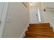 Staircase leading up to the next level with wooden steps and neutral wall colors at 2400 Cumberland Se Pkwy # 803, Atlanta, GA 30339