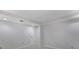 Clean basement area with painted walls, carpet, and a door at 3320 Woodleaf Way, Marietta, GA 30062