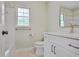 Bright bathroom featuring updated vanity with stone countertops and tile flooring at 3320 Woodleaf Way, Marietta, GA 30062