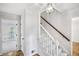 Inviting entryway with hardwood floors, staircase, and elegant lighting at 3320 Woodleaf Way, Marietta, GA 30062
