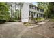 Charming two-story home with attached two-car garage and front yard landscaping at 3320 Woodleaf Way, Marietta, GA 30062