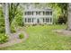 Charming two-story home with well-maintained lawn and mature trees at 3320 Woodleaf Way, Marietta, GA 30062