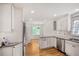 Spacious kitchen with stainless steel appliances, granite counters, and a cozy breakfast nook at 3320 Woodleaf Way, Marietta, GA 30062