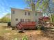 Spacious backyard featuring a large deck and mature trees, perfect for outdoor enjoyment and entertainment at 6105 Ivey Hill Dr, Cumming, GA 30040