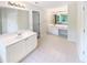 Bright bathroom featuring double vanities, ample counter space, and modern fixtures at 6105 Ivey Hill Dr, Cumming, GA 30040