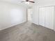 Bright bedroom featuring a ceiling fan and closet at 6105 Ivey Hill Dr, Cumming, GA 30040