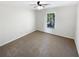 Cozy carpeted bedroom with natural lighting from window at 6105 Ivey Hill Dr, Cumming, GA 30040