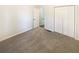 Comfortable bedroom with plush carpet, closet, and neutral walls, creating a relaxing space at 6105 Ivey Hill Dr, Cumming, GA 30040