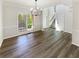 Open dining room features a modern chandelier and large windows, perfect for entertaining and Gathering meals at 6105 Ivey Hill Dr, Cumming, GA 30040