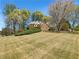 Beautiful home on a large lot with mature trees and a well-maintained lawn at 6105 Ivey Hill Dr, Cumming, GA 30040