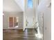 Grand foyer with soaring ceilings, transom window, and dark wood floors creates a welcoming entrance at 6105 Ivey Hill Dr, Cumming, GA 30040