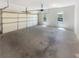 Spacious two-car garage with ample room for parking and storage with natural light from windows at 6105 Ivey Hill Dr, Cumming, GA 30040