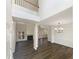 Spacious living room features a fireplace, dark wood floors, and high ceilings for a modern feel at 6105 Ivey Hill Dr, Cumming, GA 30040