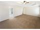 Spacious main bedroom featuring a ceiling fan and natural lighting at 6105 Ivey Hill Dr, Cumming, GA 30040