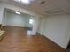 Finished basement with wood-look flooring, bright white walls, and recessed lighting at 921 Eagle Crossing Dr, Lawrenceville, GA 30044
