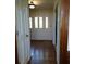 Entryway featuring beautiful wood floors and a charming front door with decorative glass at 921 Eagle Crossing Dr, Lawrenceville, GA 30044