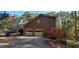 Two-car garage with side deck and driveway, offering parking and outdoor space at 921 Eagle Crossing Dr, Lawrenceville, GA 30044