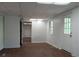 Large living room with wood-look flooring and natural light at 921 Eagle Crossing Dr, Lawrenceville, GA 30044