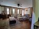 Cozy living room with hardwood floors, neutral walls, and lots of natural light at 921 Eagle Crossing Dr, Lawrenceville, GA 30044