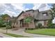 Community clubhouse with stone and siding exterior, manicured lawn at 2060 Executive Dr, Duluth, GA 30096
