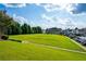 Expansive green space area in the community with walking path at 2060 Executive Dr, Duluth, GA 30096