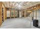 Spacious unfinished basement with exposed ceiling, offering potential for customization and additional living space at 3115 Corsair Curv, Cumming, GA 30040