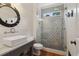 Bathroom features a decorative tile shower, white vanity, and modern finishes at 3115 Corsair Curv, Cumming, GA 30040