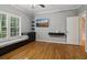 Bedroom with gleaming wood floors, built in bench seating and a large window at 3115 Corsair Curv, Cumming, GA 30040