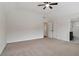 Bedroom with neutral carpet, a ceiling fan, vaulted ceiling, and access to an ensuite bath at 3115 Corsair Curv, Cumming, GA 30040