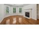 Elegant bedroom showcasing a cozy fireplace and plantation-shuttered windows at 3115 Corsair Curv, Cumming, GA 30040