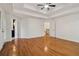 Large primary bedroom with hardwood floors and multiple entryways at 3115 Corsair Curv, Cumming, GA 30040