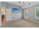 Bright bedroom featuring outdoor access, light-filled windows, and neutral finishes at 3115 Corsair Curv, Cumming, GA 30040