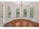 Cozy breakfast nook with hardwood floors, plantation shutters, and a chandelier at 3115 Corsair Curv, Cumming, GA 30040