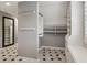 Well-organized walk-in closet featuring custom shelving and hanging rods for efficient storage solutions at 3115 Corsair Curv, Cumming, GA 30040