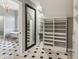 A closet featuring white shelving and drawers, and a view of a bathroom through the doorway at 3115 Corsair Curv, Cumming, GA 30040