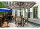 Outdoor deck with dining set under a striped umbrella and grill; great for entertaining at 3115 Corsair Curv, Cumming, GA 30040