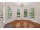 Dining nook with hardwood floors, large windows, and plantation shutters for natural light at 3115 Corsair Curv, Cumming, GA 30040