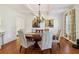 Bright dining area with hardwood floors, chandelier, and natural light at 3115 Corsair Curv, Cumming, GA 30040