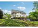 Large backyard with a beautiful lawn, deck, and fence at 3115 Corsair Curv, Cumming, GA 30040